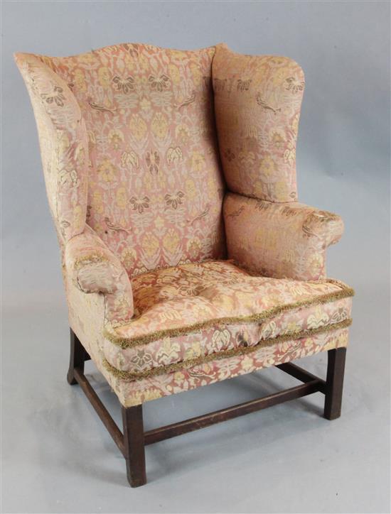 A George III mahogany wing armchair, W.2ft 10in. D.2ft 3in. H.3ft 8in.